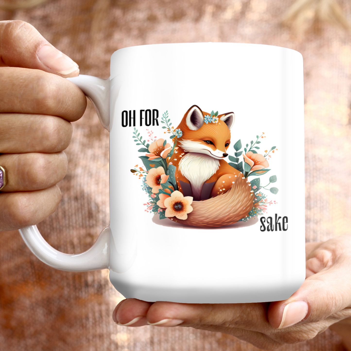 Woman holding White Oh For Fox Sake Sarcastic Cute Mug, 15oz with fox with a bushy tail and peach flowers around it