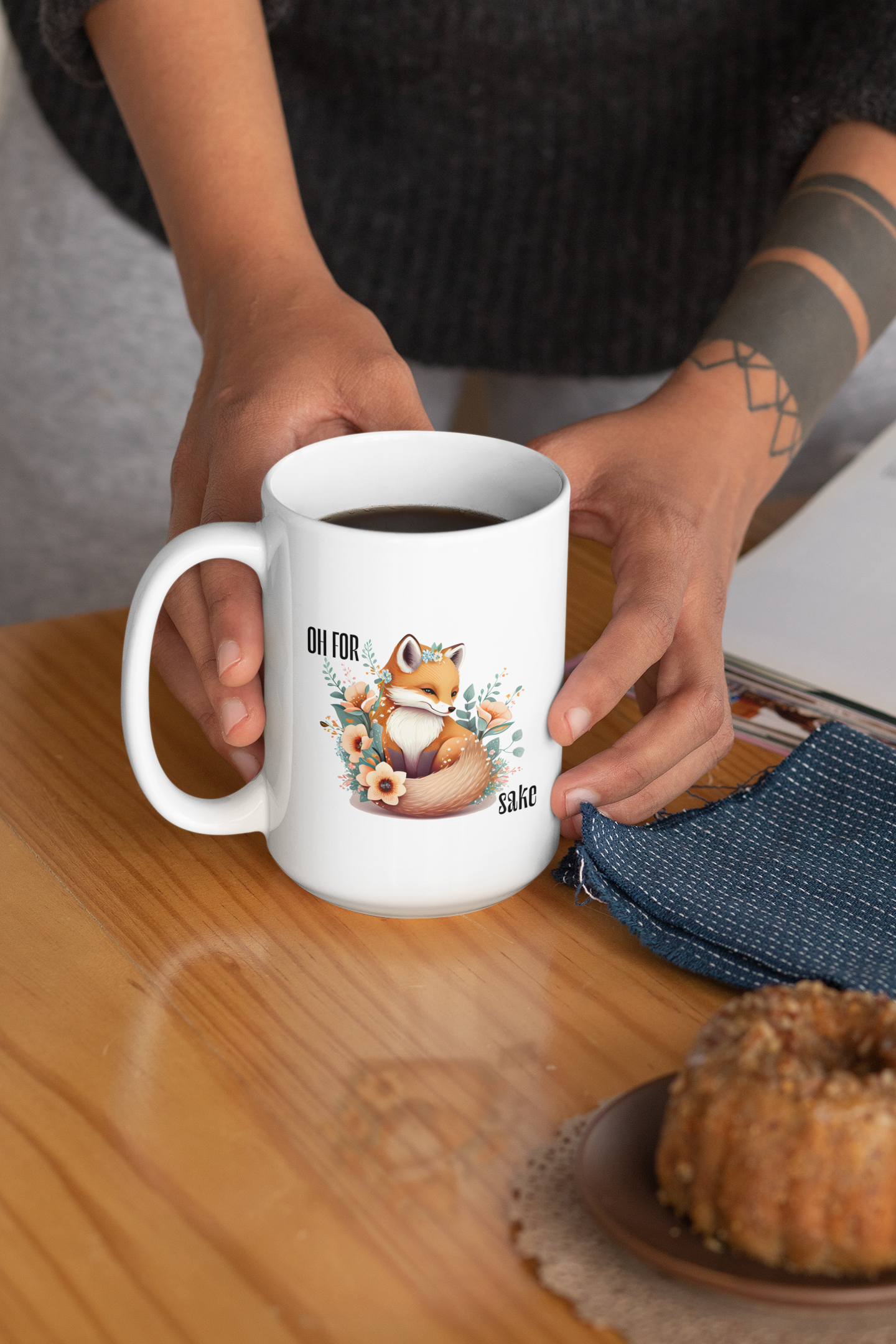 tattooed Woman holding White Oh For Fox Sake Sarcastic Cute Mug, 15oz with fox with a bushy tail and peach flowers around it